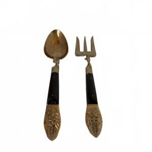 Ornate Thai brass and bronze serving spoon and fork with twisted handles.